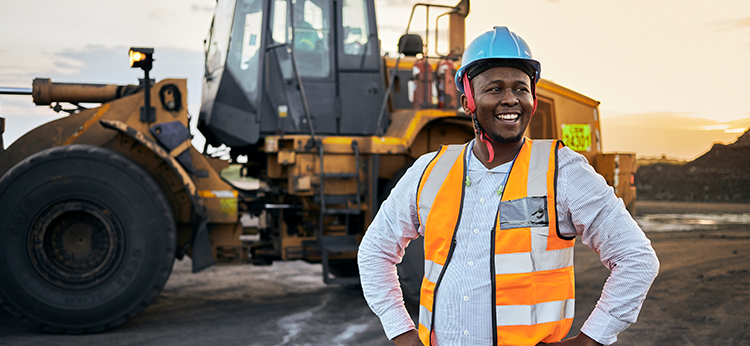 Man standing in front of wheel loader